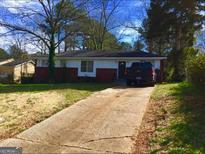 Ranch style home with brick facade and driveway at 3159 Bobolink Dr, Decatur, GA 30032