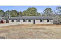 Newly built single-story home with a large yard at 234 Willis Rd, Sharpsburg, GA 30277