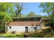 Brick ranch house with a large backyard and partial basement at 2176 Lilac Ln, Decatur, GA 30032