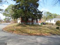 Brick house with a spacious yard at 2635 Godfrey Nw Dr, Atlanta, GA 30318