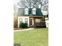 Two-story Craftsman style home with white siding, dark trim, and a front porch at 1279 Allene Sw Ave, Atlanta, GA 30310