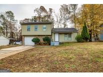 Ranch style home with attached garage and landscaped yard at 2994 Meadow Wood Ct, Lawrenceville, GA 30044