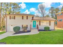 Charming ranch home with a freshly painted exterior and well-manicured lawn at 2629 Preston Dr, Decatur, GA 30034