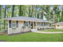 Updated ranch home with landscaped yard and walkway at 2780 Mitchell Dr, Decatur, GA 30032