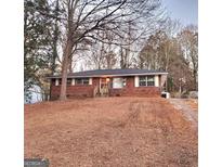 Brick ranch home with a spacious yard at 485 Evergreen Dr, Forest Park, GA 30297