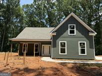 New construction home featuring green siding, white trim, and a welcoming front porch at 150 Asa Moseley Rd, Mcdonough, GA 30252