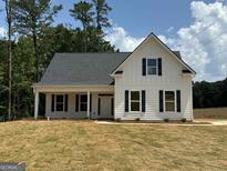 Charming home featuring board and batten siding, a covered porch, and black shutters at 136 Asa Moseley Rd, Mcdonough, GA 30252