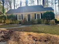 Ranch style home with stone facade and landscaping at 1758 S Alvardo Ter, Atlanta, GA 30311