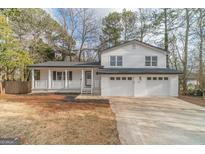 Charming two-story home with a covered front porch and a two-car garage at 356 Norhill Ct, Lawrenceville, GA 30046