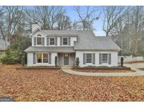 Two-story house with gray roof, white siding, and landscaping at 332 Summer Pl, Peachtree City, GA 30269
