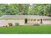 Ranch home with a well-maintained lawn and updated facade at 1271 Avonwood Sw Cir, Atlanta, GA 30311