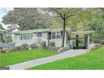 Charming ranch home with a landscaped yard and carport at 1931 Sandringham Sw Dr, Atlanta, GA 30311