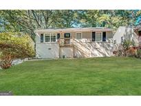 Updated Ranch home with new paint, steps, and landscaping at 490 Woods Dr, Atlanta, GA 30318