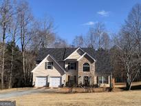 Two-story house with stone accents and a two-car garage at 106 Old Gettysburg Way, Dallas, GA 30157