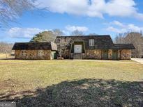 Ranch style home with stone facade and large yard at 107 Stratford Ct, Peachtree City, GA 30269