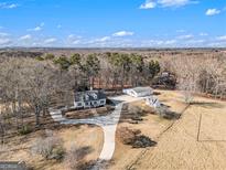 Aerial view of a house with detached garage and large lot at 295 W 5 Hwy, Roopville, GA 30170