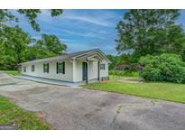 Ranch home with carport and spacious yard at 1198 E Atlanta Rd, Stockbridge, GA 30281