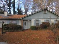 Charming single-story home with a well-maintained front yard and inviting entrance at 7755 Chase Woods Dr, Jonesboro, GA 30236