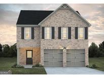 Charming two-story brick home with a two-car garage and black shutters at 5314 Tolar Rd # 23, South Fulton, GA 30213