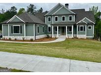 An inviting two-story home boasts meticulous landscaping and charming curb appeal at 130 Dockside Dr # 380, Fayetteville, GA 30215