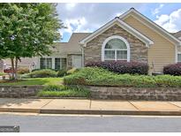 Charming home with stone accents, manicured landscaping, and a welcoming facade at 430 Rehobeth Way, Fayetteville, GA 30214