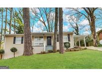 Charming single-story home with well-maintained lawn, covered parking and a welcoming front porch at 2634 Rockcliff Se Rd, Atlanta, GA 30316