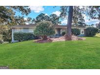 Charming ranch-style home with a well-maintained front yard and mature landscaping at 3820 Union Sw Rd, College Park, GA 30349