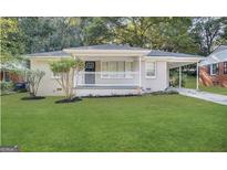Charming single-story home with a welcoming front porch and a well-manicured lawn at 191 Florida Sw Ave, Atlanta, GA 30310