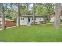 Charming single-story home features a well-manicured front yard and inviting entryway at 2193 Polar Rock Sw Ave, Atlanta, GA 30315