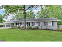 Charming one-story home with a well-maintained lawn and mature tree at 3976 Bright Star Rd, Douglasville, GA 30135