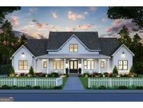 Inviting two-story modern farmhouse with charming front porch and white picket fence and lush landscaping at 0 Lot 2 Mcbride Rd, Fayetteville, GA 30215