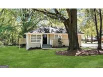 Charming single-story home with a well-maintained front yard and inviting entryway at 2004 Shamrock Dr, Decatur, GA 30032