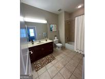 Neutral bathroom featuring a single vanity, shower-tub combo with tiled walls and a framed piece of artwork at 870 Nw Mayson Turner Nw Rd # 1227, Atlanta, GA 30314