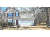 Charming two-story home with a brick facade, attached garage, and well-maintained front yard at 801 Winbrook Dr, Mcdonough, GA 30253