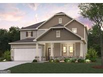 Charming two-story home featuring a welcoming front porch and a two-car garage, nestled in a well-maintained lawn at 2389 Brown Dove Way # 5, Grayson, GA 30017