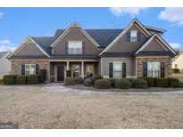 Charming home featuring stone accents, symmetrical design, and well-maintained landscaping at 37 Water Oak Dr, Sharpsburg, GA 30277