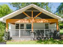 Charming home with a welcoming front porch and unique architectural details at 2209 Browns Mill Se Rd, Atlanta, GA 30315