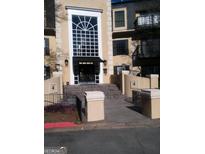 Exterior shot of building featuring entrance with white trim, black awning, and second story balcony at 4111 Pine Heights Ne Dr, Atlanta, GA 30324