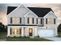 Charming two-story brick home with a two-car garage and inviting front porch at 116 Jacoby Dr # 112, Fairburn, GA 30213