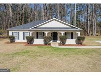 Charming single story home with black shutters and a well-maintained front lawn at 505 Phillips Dr, Palmetto, GA 30268