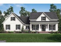 Charming, new two-story home with black shutters and a beautifully landscaped front yard at 4585 Parkwood Dr, Social Circle, GA 30025