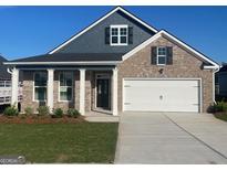 Beautiful new construction brick home with a two-car garage and inviting front porch at 741 Myrica Ave, Locust Grove, GA 30248