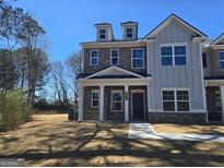 Beautiful two-story home with stone facade, dormers, and covered entrance at 4853 Walkers Green, Mableton, GA 30126