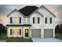 Charming two-story home featuring a brick facade, black shutters and a two-car garage at 1594 Sungrown Way, Mcdonough, GA 30253