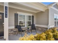 Charming front porch with seating area, perfect for enjoying the outdoors at 3891 Shelleydale Dr, Powder Springs, GA 30127