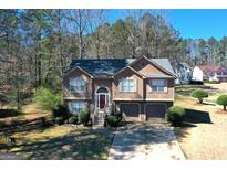 Charming two-story home with a well-manicured lawn and a two-car garage, perfect for suburban living at 1630 Versailles Sw Dr, Atlanta, GA 30331