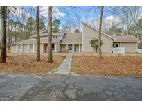 Charming home features a unique architectural design and inviting walkway at 106 Robinson Bend Trl, Peachtree City, GA 30269