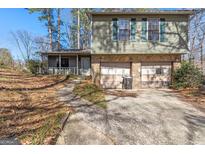 Charming split-level home with stone accents and a two-car garage at 4847 Royal Dr, Duluth, GA 30096