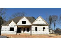 New construction home featuring a gabled roof and framed windows ready for finishing at 349 Lowbrooke Ct # 19, Fairburn, GA 30213