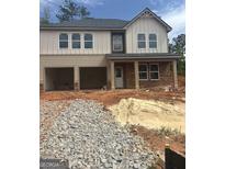 Two-story home with attached two-car garage and a charming brick-columned porch at 742 Great Oak Pl # 13, Villa Rica, GA 30180